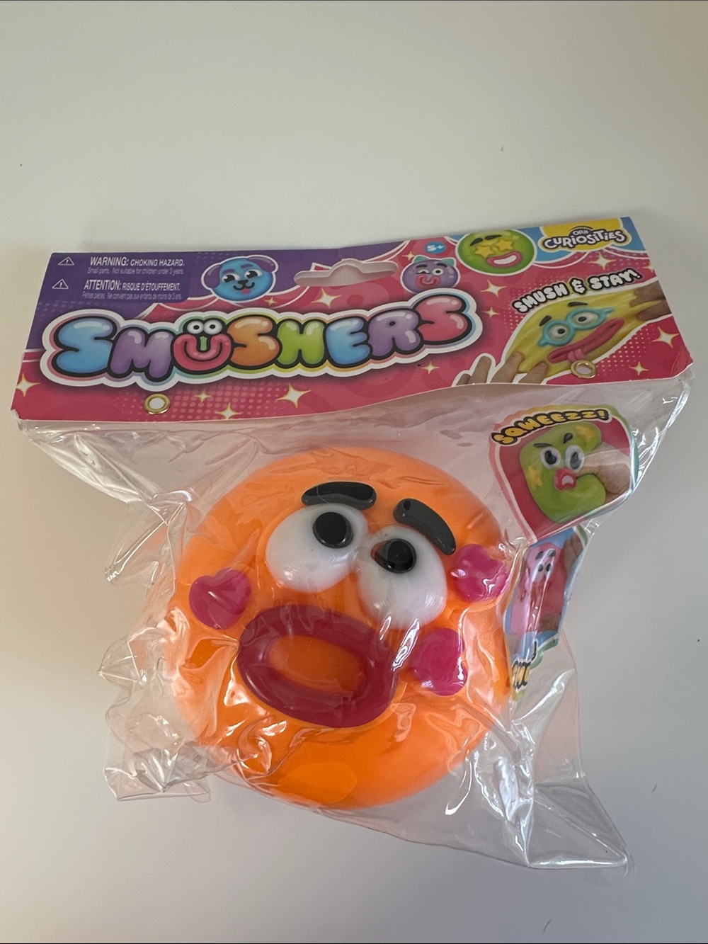 SMUSHERS Orange Squishy Squeeze Face Sensory Fidget Toy - Orb Curiosities